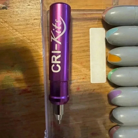 Cricut official market set and a CriKit embossing attachment w/instructions. - Picture 2 of 2